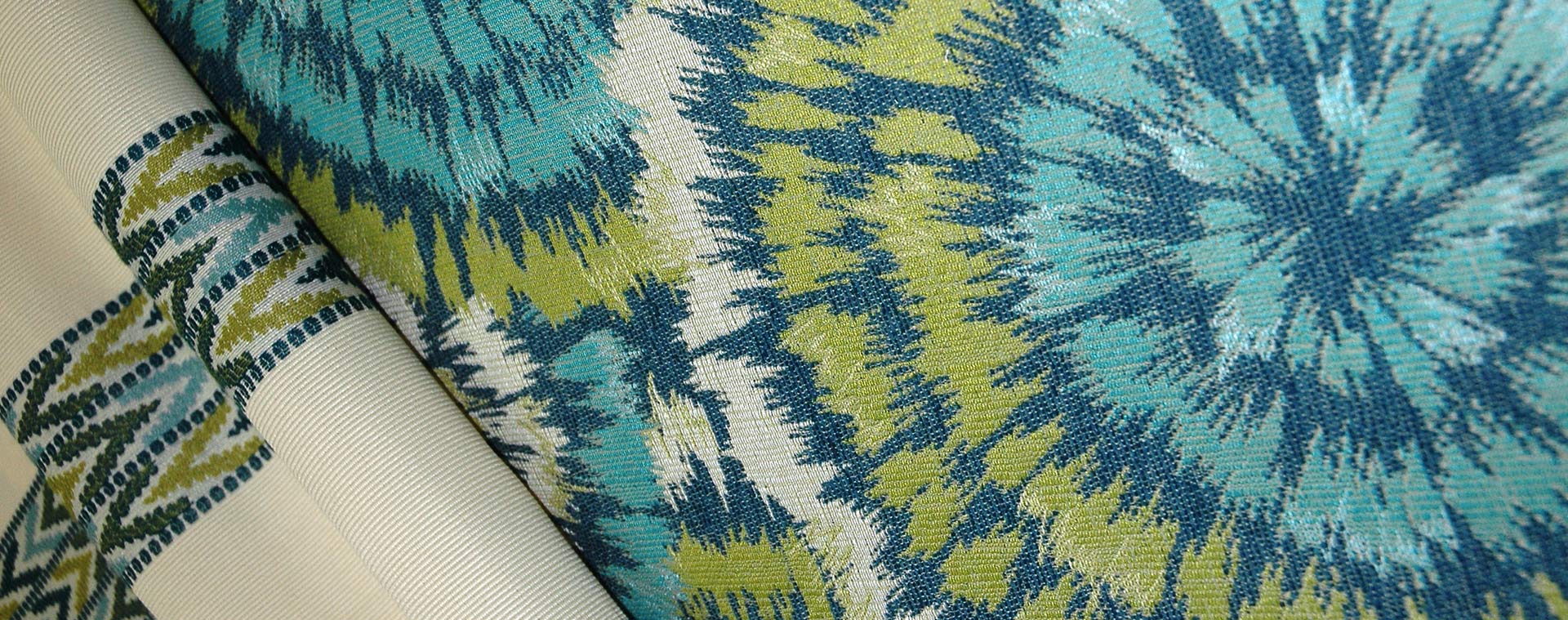 A curated wall of Duralee designer drapery and upholstery fabric samples in warm tones